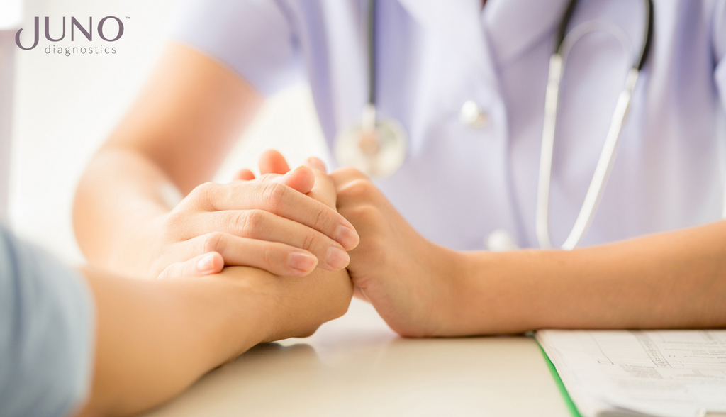 A genetic counselor consults with expecting mom to discuss trisomy 13