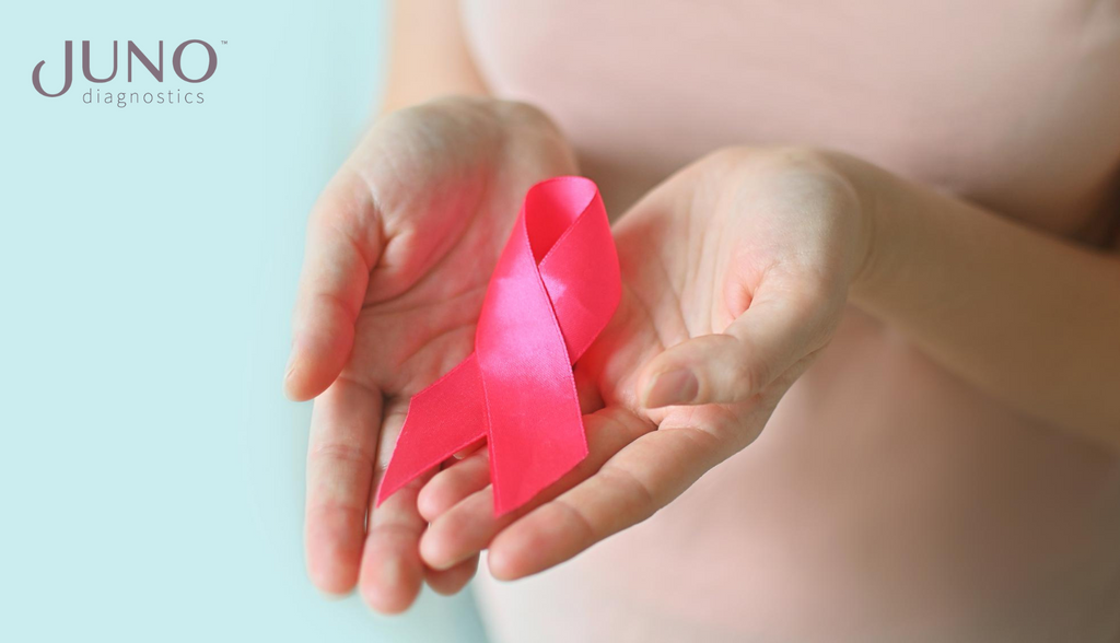 Breast cancer awareness pregnant woman in pink t-shirt with hand holding pink ribbon