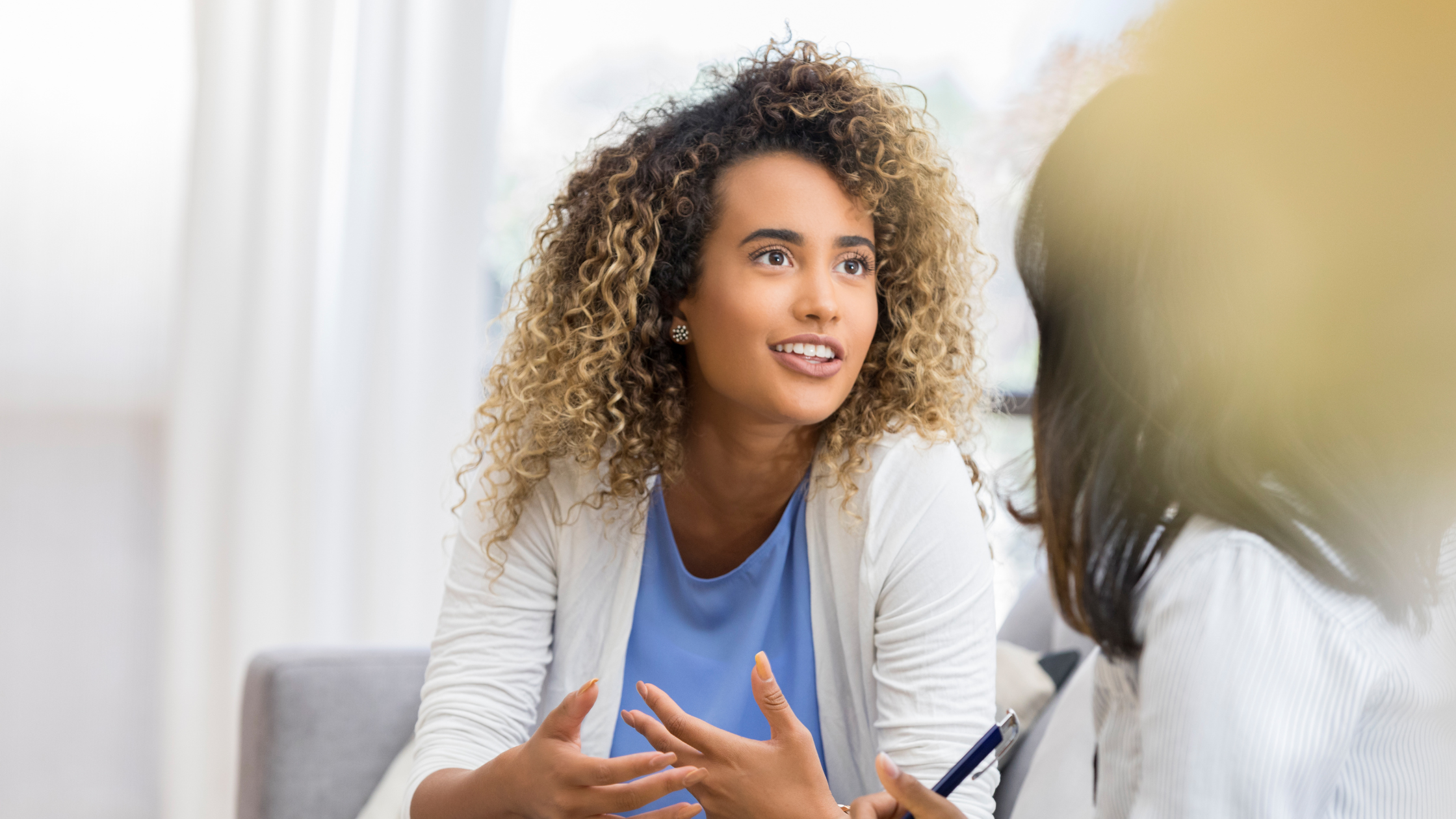 pregnant woman speaking with a health professional